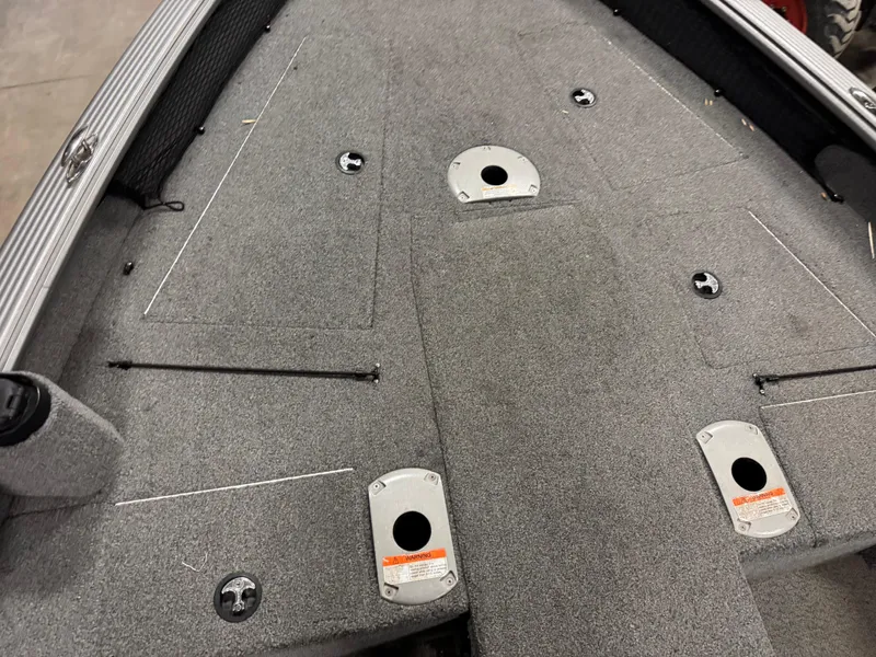 Slide: The Image of 2016 Lund 1875 Pro Guide boat deck with carpeted surface and mounting points. - 7