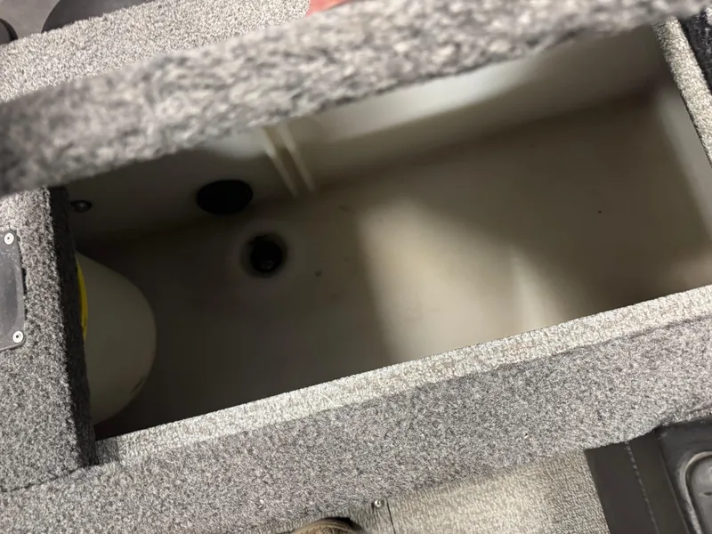 Slide: The Image of Open storage compartment in 2016 Lund 1875 Pro Guide boat. - 8