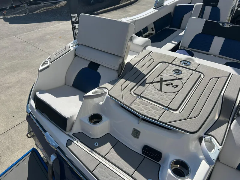Slide: The Image of 2020 MasterCraft X24 boat interior with seating and storage compartments. - 11