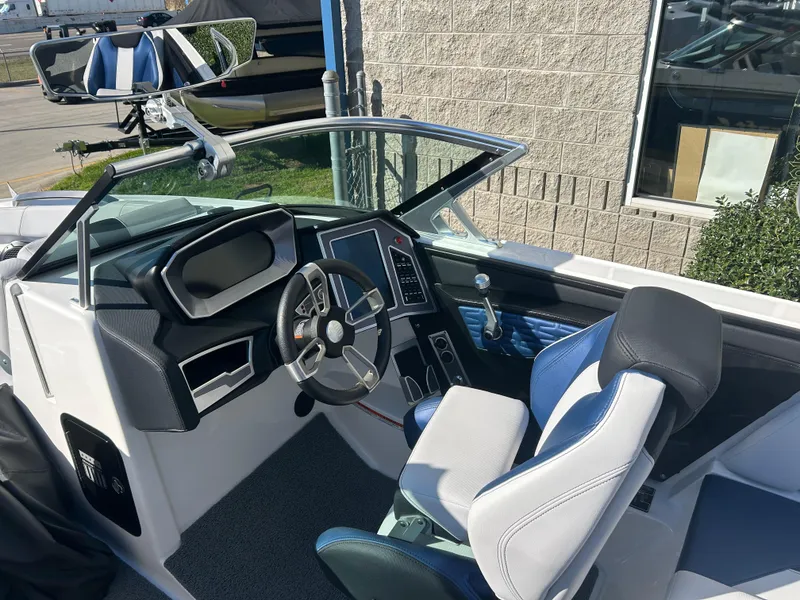 Slide: The Image of 2020 MasterCraft X24 boat interior with modern dashboard and steering wheel. - 8