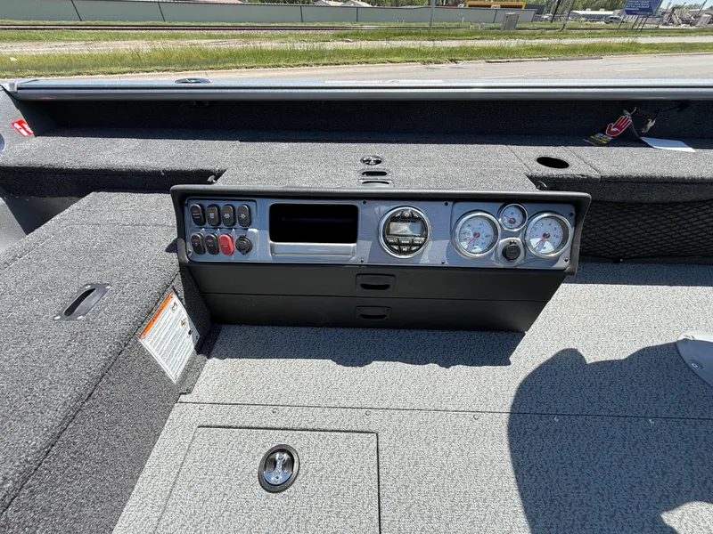 Slide: The Image of 2025 Lund 1875 Pro Guide boat dashboard with gauges and controls, featuring a sleek design. - 9