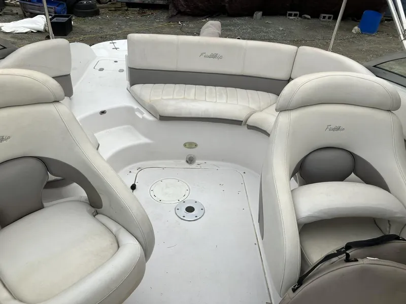 Slide: The Image of 2002 Four Winns 214 Funship boat interior with white seating and spacious layout. - 5