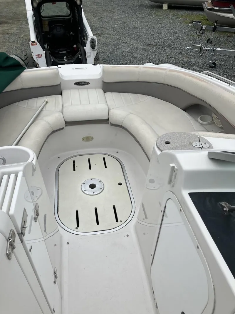 Slide: The Image of 2002 Four Winns 214 Funship boat interior with white seating and deck. - 9