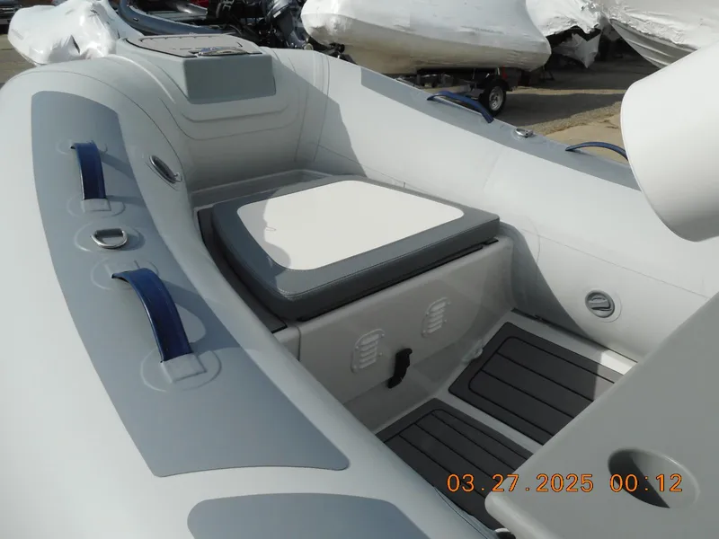 Slide: The Image of 2025 Highfield Classic 310 inflatable boat interior with seating and storage. - 6