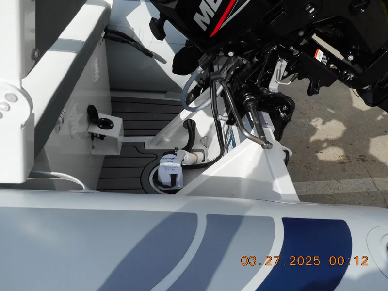 Slide: The Image of 2025 Highfield Classic 310 boat with motor, interior view, featuring modern design elements. - 8