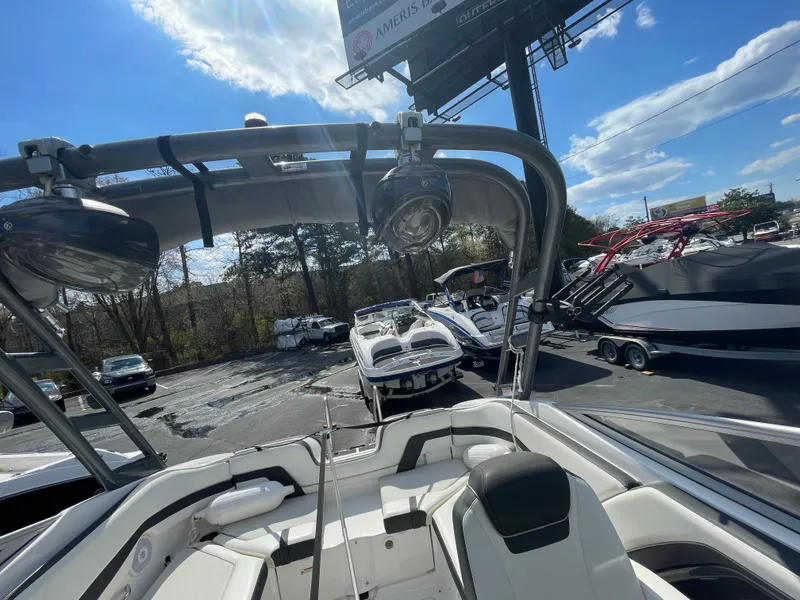 Slide: The Image of 2015 Yamaha AR240 High Output boat in a sunny outdoor showroom. - 15