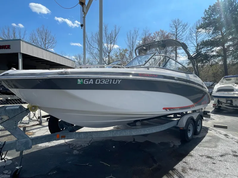 Slide: The Image of 2015 Yamaha AR240 High Output boat on trailer, parked outdoors under clear sky. - 3