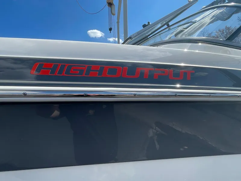 Slide: The Image of 2015 Yamaha AR240 High Output boat with sleek design and bold red lettering. - 4