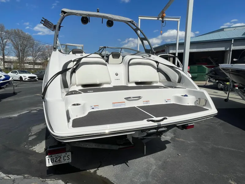 Slide: The Image of 2015 Yamaha Boats AR240 High Output, rear view at a marina. - 7