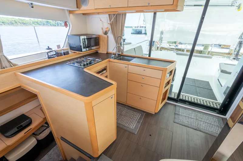 Slide: The Image of Modern kitchen interior of 2017 Lagoon 42 catamaran with sleek countertops and ample storage. - 21
