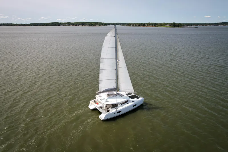 Slide: The Image of Sailing Lagoon 42 catamaran from 2017 gliding on open water. - 6