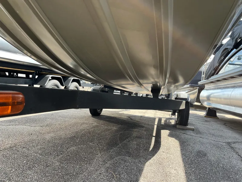 Slide: The Image of 2022 Tracker Grizzly 1648 Jon boat underside view on trailer. - 2