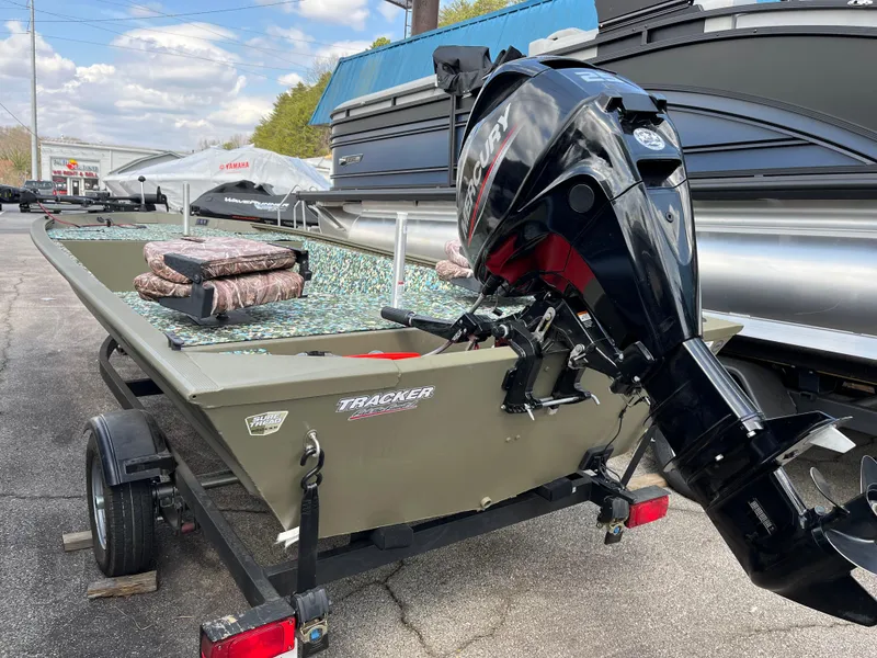 Slide: The Image of 2022 Tracker Grizzly 1648 Jon boat with motor on trailer. - 5