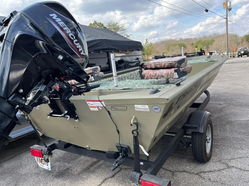 Slide: The Image of 2022 Tracker Grizzly 1648 Jon boat with Mercury engine on trailer. - 6