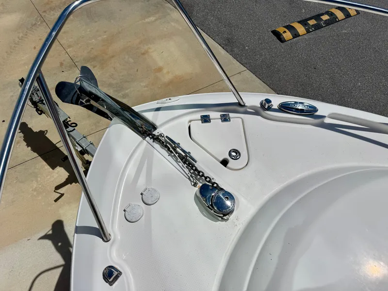 Slide: The Image of 2015 Robalo R245 Walkaround boat deck with anchor and railing. - 7