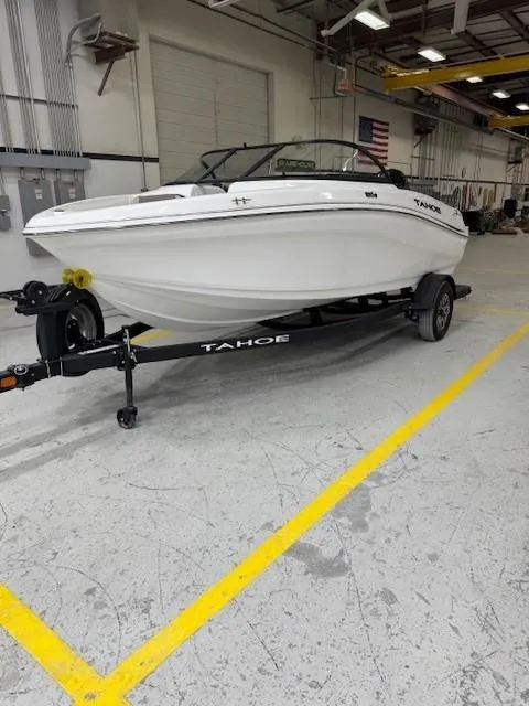 Slide: The Image of 2024 Tahoe 185 S boat on trailer in indoor facility. - 5