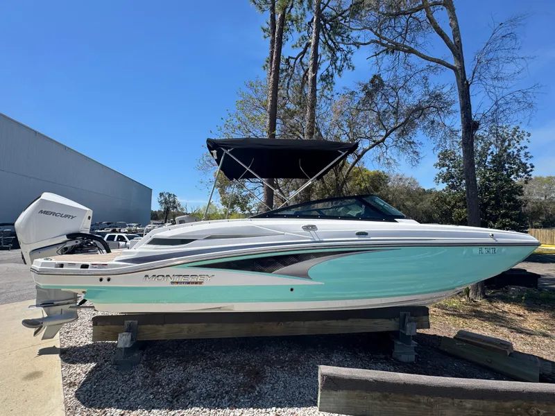 Slide: The Image of 2023 Monterey M-45 boat with canopy, parked outdoors on a sunny day. - 11