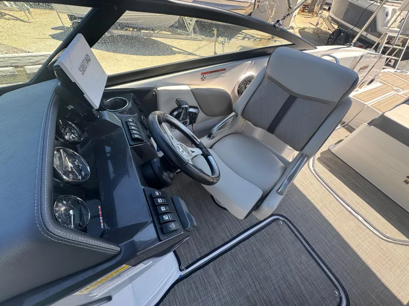 Slide: The Image of 2023 Monterey M-45 boat cockpit with steering wheel and modern dashboard controls. - 5