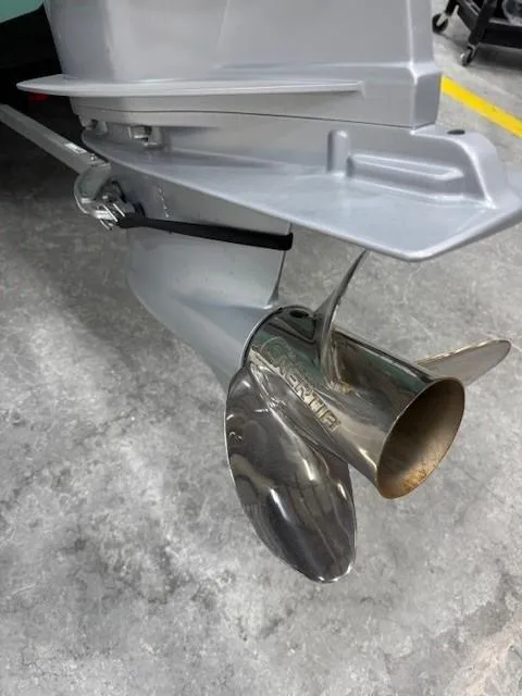 Slide: The Image of 2024 Tahoe 2150 CC boat propeller on concrete floor. - 2