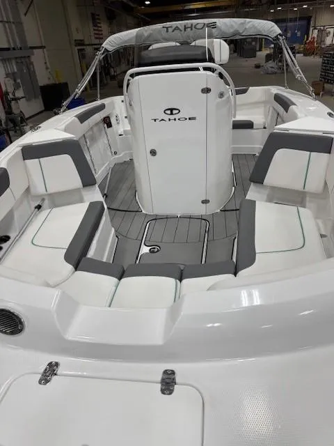 Slide: The Image of 2024 Tahoe 2150 CC boat interior with seating and console, featuring modern design and spacious layout. - 4