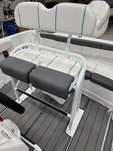Slide: The Image of 2024 Tahoe 2150 CC boat interior with cushioned seating and sleek design. - 5