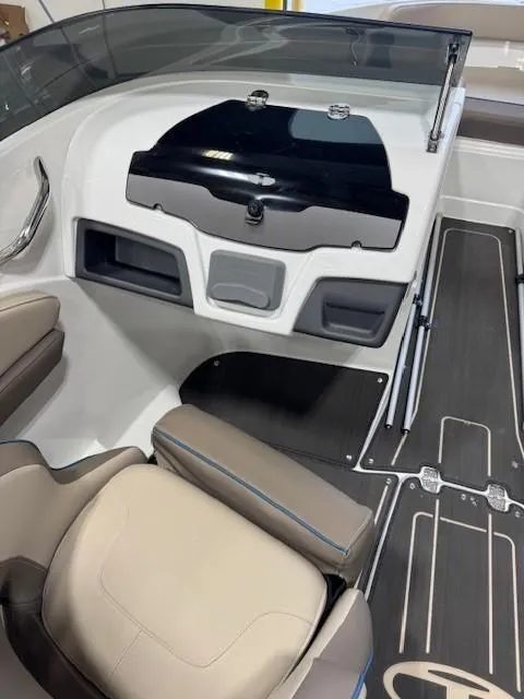 Slide: The Image of 2024 Tahoe 210 S Limited boat interior with sleek dashboard and comfortable seating. - 8