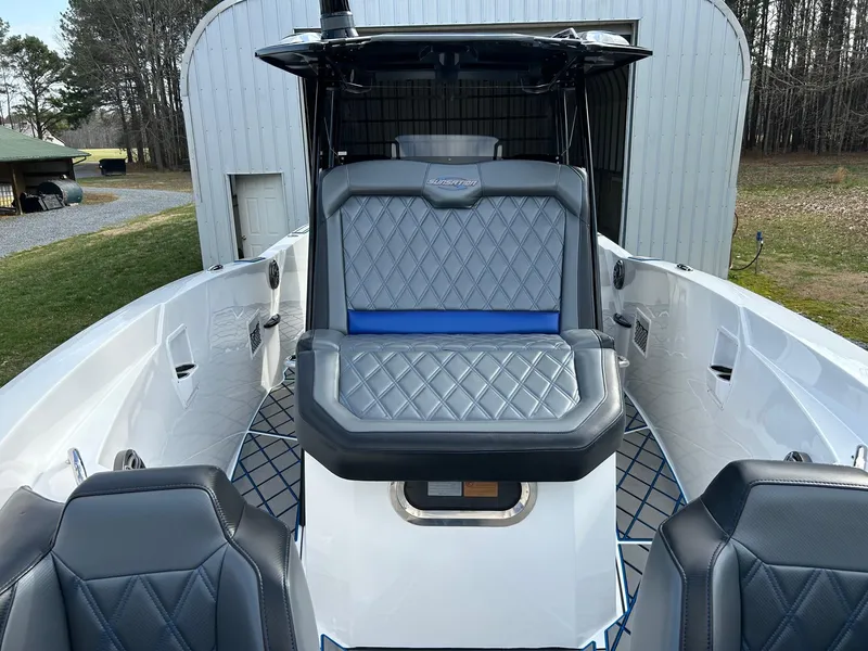 Slide: The Image of 2020 Sunsation 32 CCX boat with luxurious seating and sleek design in a storage area. - 10