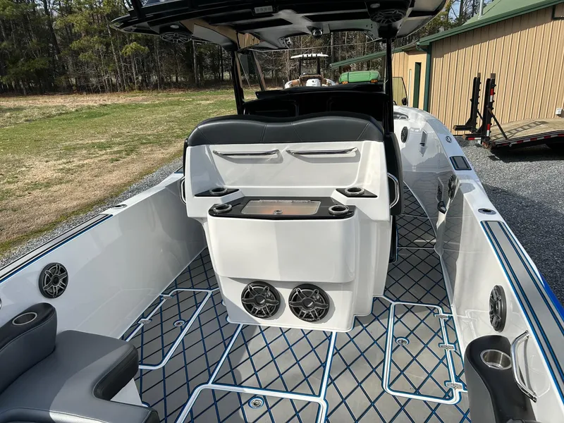 Slide: The Image of 2020 Sunsation 32 CCX boat interior with modern seating and sound system. - 11