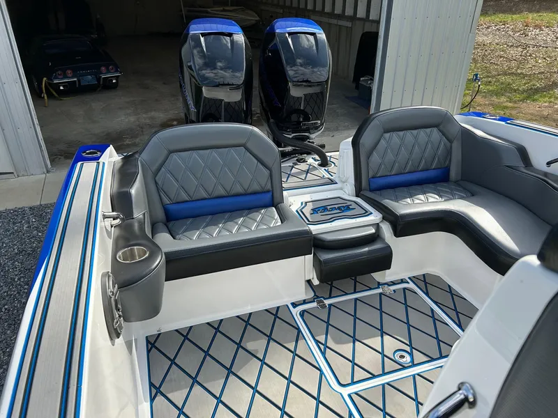 Slide: The Image of 2020 Sunsation 32 CCX boat interior with stylish seating and dual outboard motors. - 12