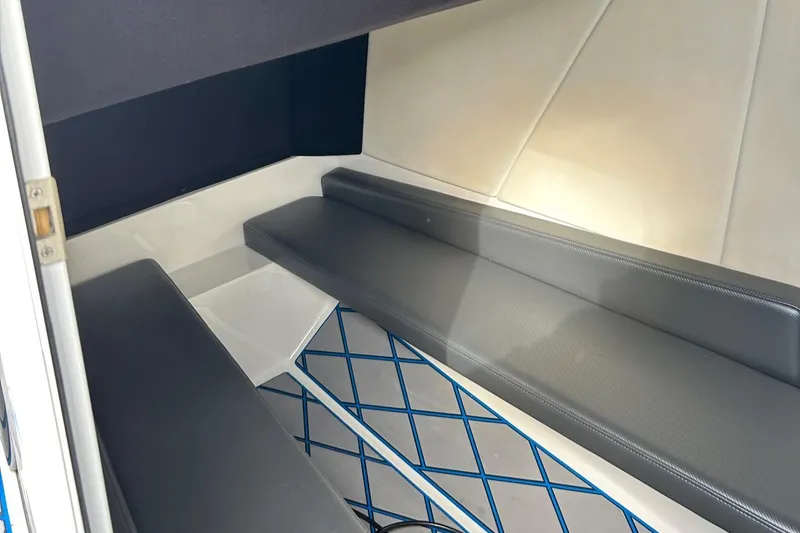 Slide: The Image of 2020 Sunsation 32 CCX cabin interior with cushioned seating and patterned flooring. - 14