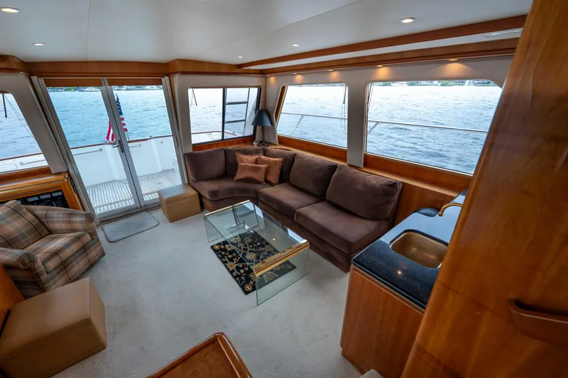 Slide: The Image of Luxurious interior of 2001 West Bay 58 RPH yacht with plush seating and ocean view. - 10