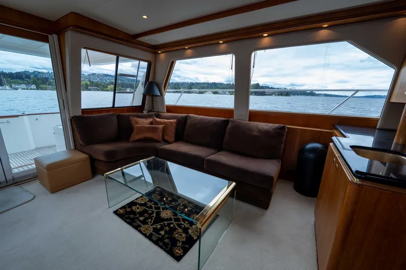 Slide: The Image of Luxurious interior of 2001 West Bay 58 RPH yacht with scenic water views. - 11