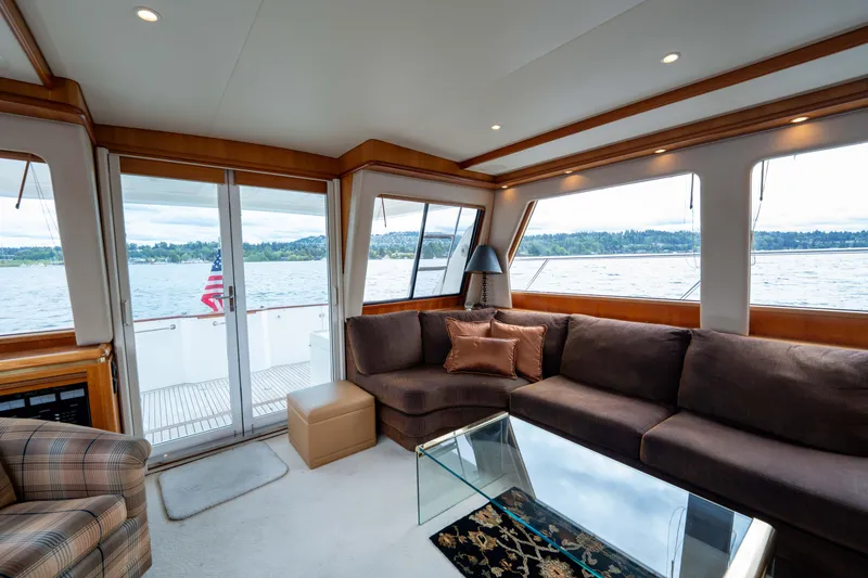 Slide: The Image of Luxurious interior of 2001 West Bay 58 RPH yacht with scenic water view. - 13