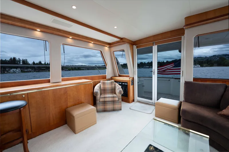 Slide: The Image of Luxurious interior of 2001 West Bay 58 RPH yacht with scenic water views. - 16