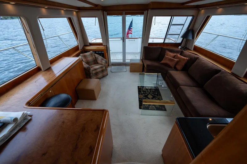 Slide: The Image of Luxurious interior of 2001 West Bay 58 RPH yacht with elegant seating and panoramic windows. - 17