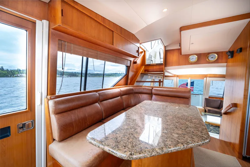 Slide: The Image of Luxurious interior of 2001 West Bay 58 RPH yacht with leather seating and granite table. - 20