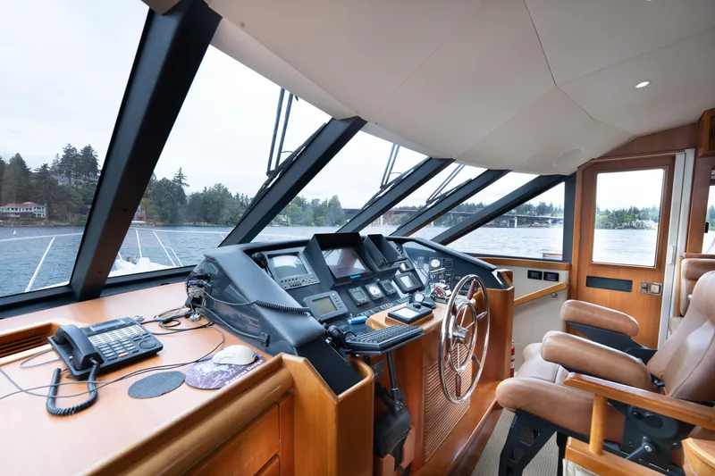 Slide: The Image of Pilothouse interior of 2001 West Bay 58 RPH yacht with navigation equipment and panoramic windows. - 24