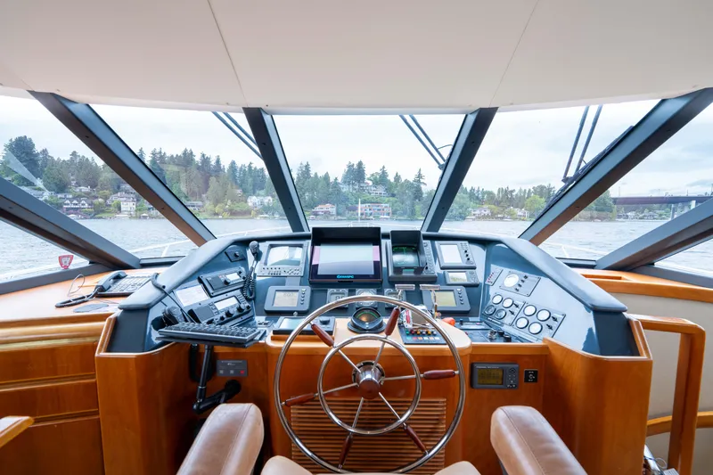 Slide: The Image of Helm of 2001 West Bay 58 RPH yacht with modern navigation equipment and panoramic view. - 27