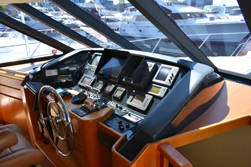 Slide: The Image of Helm of 2001 West Bay 58 RPH yacht with advanced navigation equipment. - 31