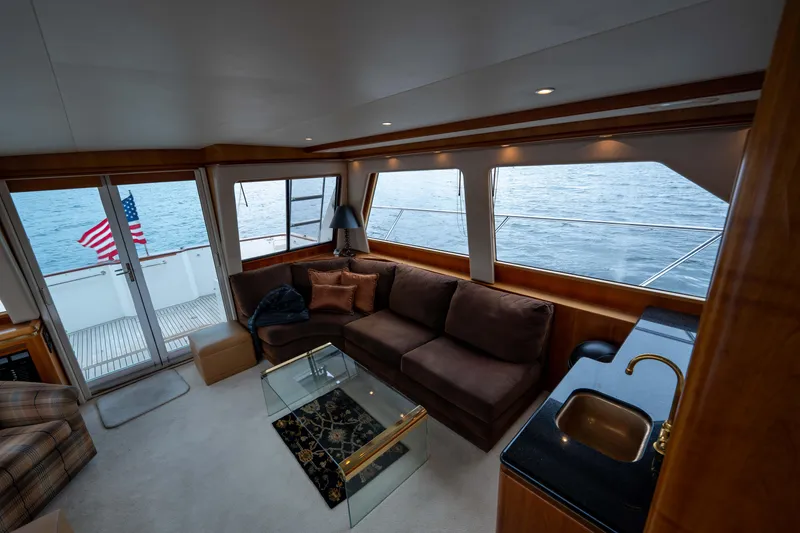 Slide: The Image of Luxurious interior of 2001 West Bay 58 RPH yacht with ocean view and elegant furnishings. - 4