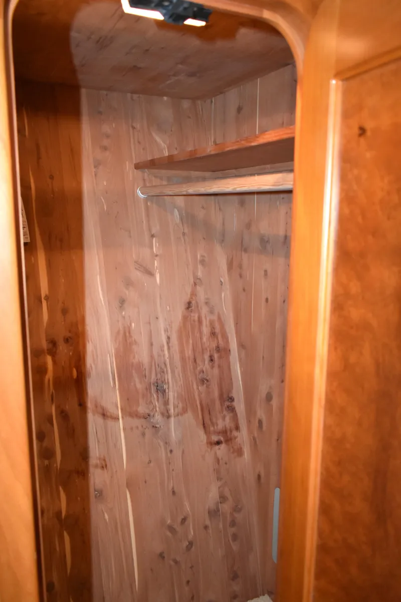 Slide: The Image of Wooden closet interior on 2001 West Bay 58 RPH yacht. - 45