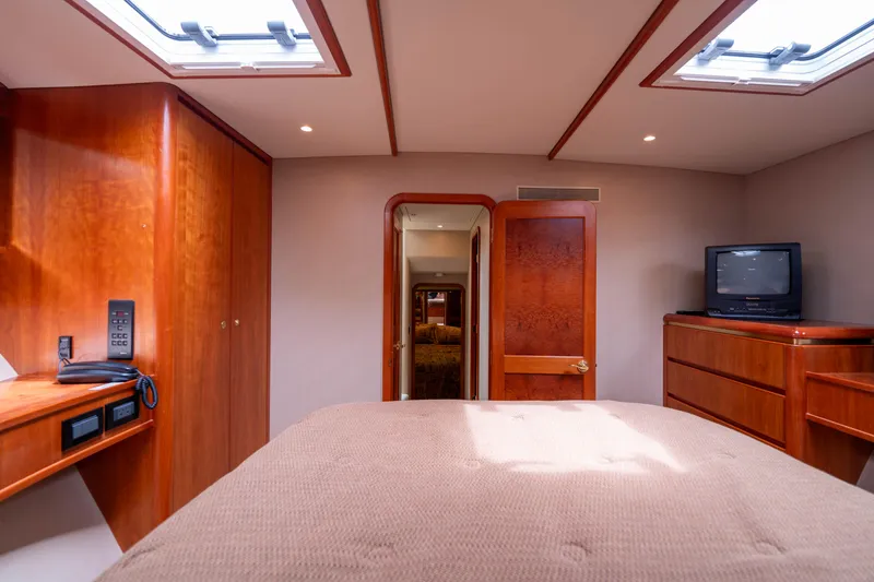Slide: The Image of Luxurious cabin interior of 2001 West Bay 58 RPH yacht with wood furnishings. - 47