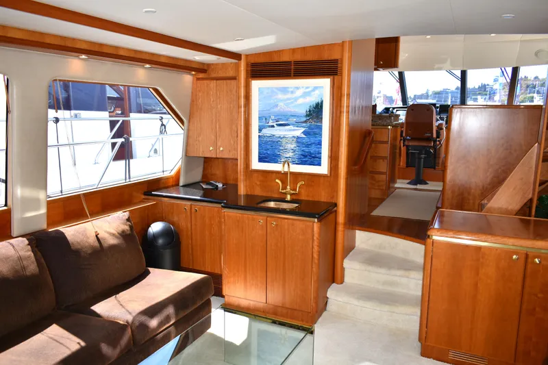 Slide: The Image of Luxurious interior of 2001 West Bay 58 RPH yacht with wood finishes and modern amenities. - 8