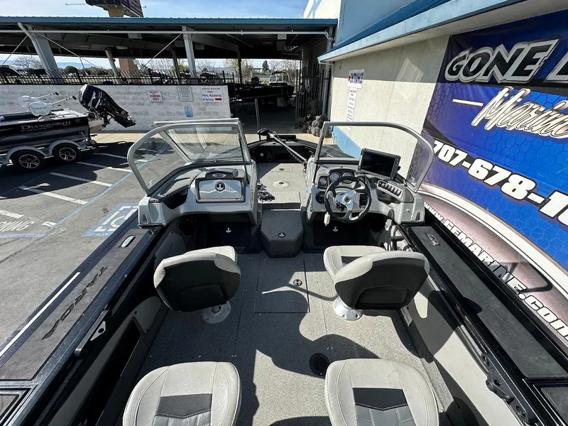 Slide: The Image of 2018 Tracker Targa V-19 WT boat interior with dual consoles and seating. - 10
