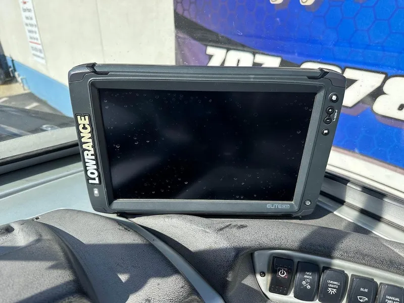 Slide: The Image of Lowrance Elite fish finder on 2018 Tracker Targa V-19 WT dashboard. - 14