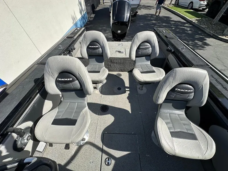 Slide: The Image of 2018 Tracker Targa V-19 WT boat interior with four gray seats. - 19