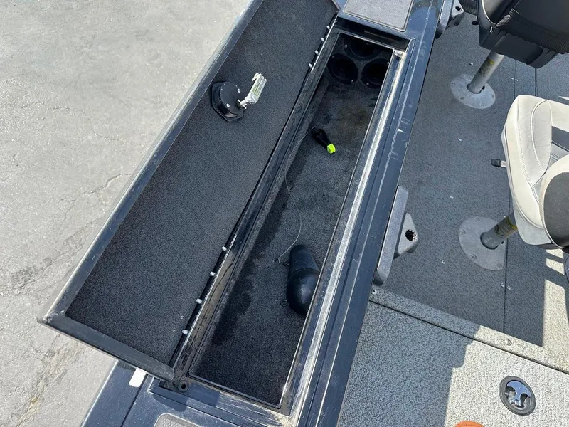 Slide: The Image of Open storage compartment on 2018 Tracker Targa V-19 WT boat interior. - 25