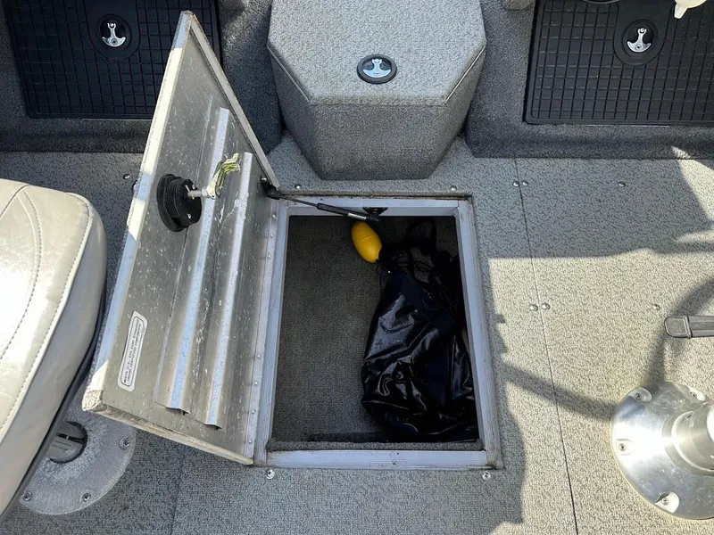 Slide: The Image of Open storage compartment in 2018 Tracker Targa V-19 WT boat interior. - 27