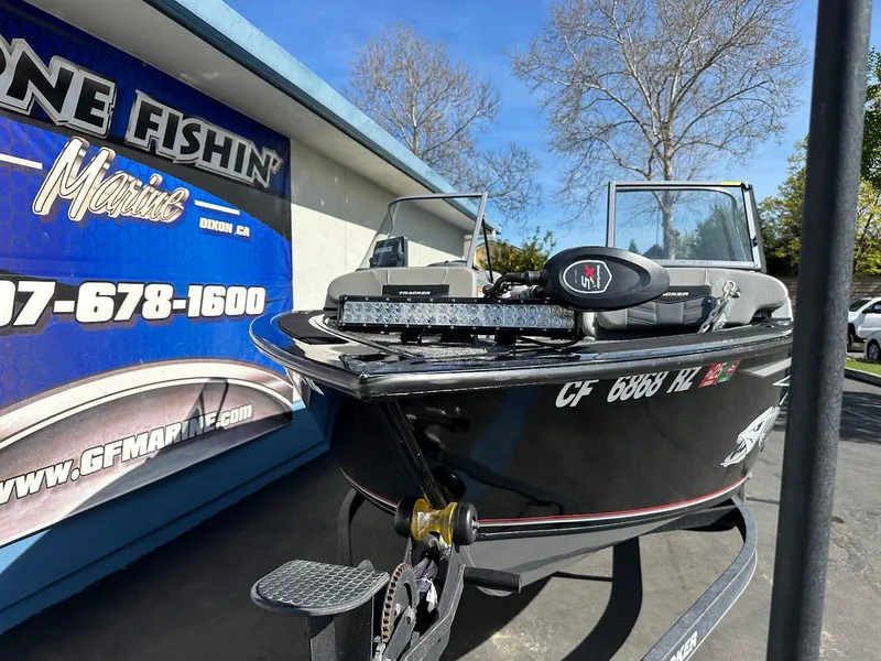 Slide: The Image of 2018 Tracker Targa V-19 WT boat displayed outside a marine shop. - 4