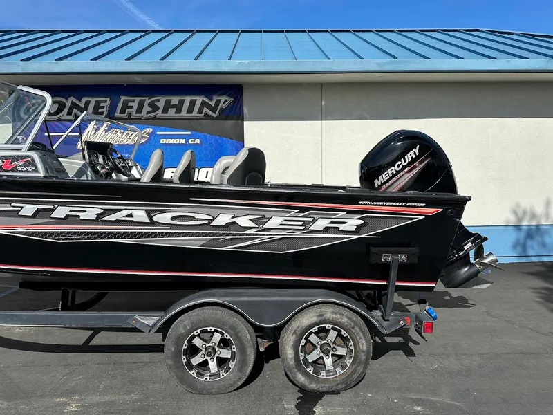 Slide: The Image of 2018 Tracker Targa V-19 WT boat with Mercury engine on a trailer. - 6